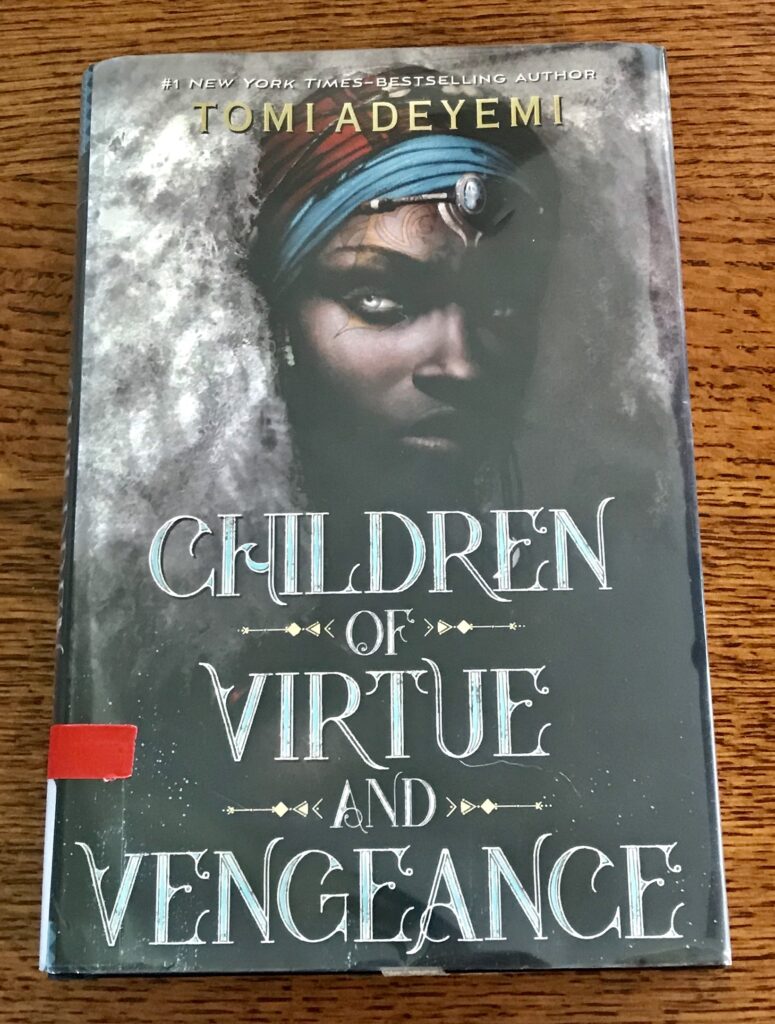 The cover of Children of Virtue and Vengeance shows a black woman with white hair and gold tattoos