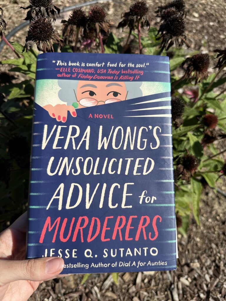 Held over some dead flowers, the cover of Vera Wong shows an older lady peeking through Venetian blinds