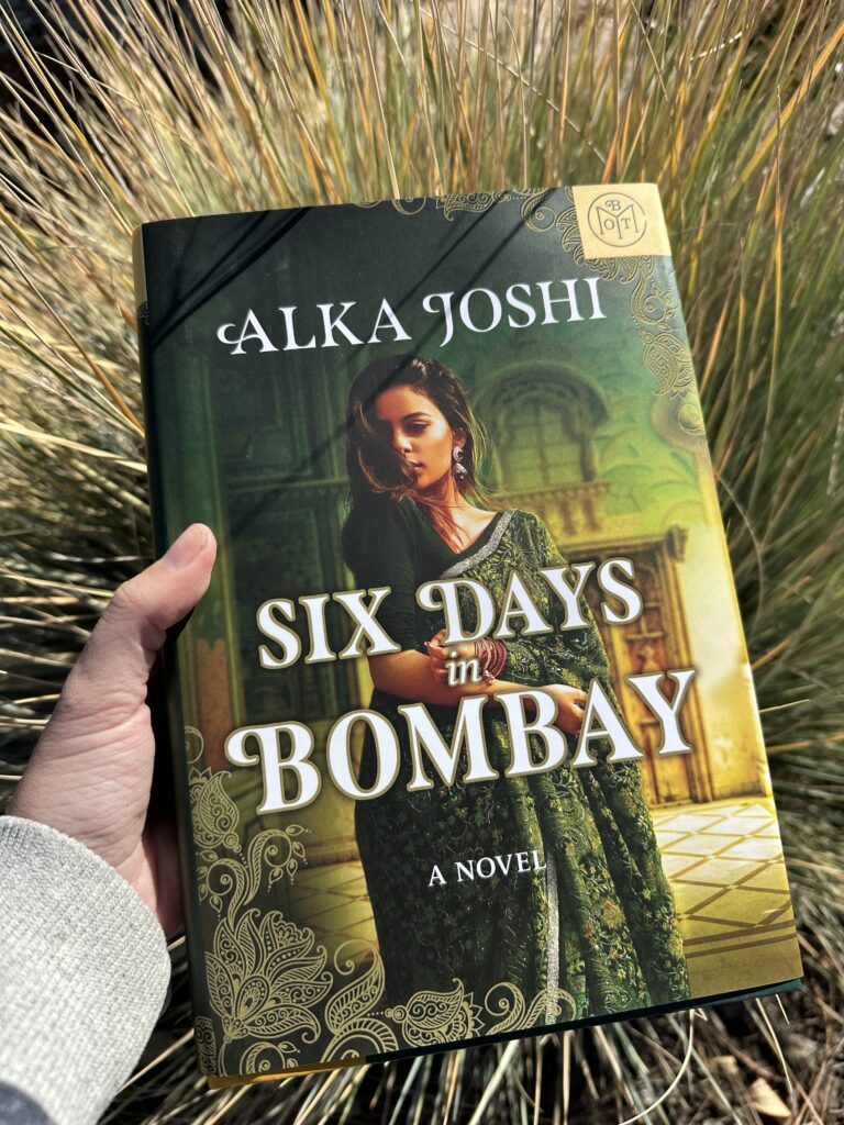 The cover of Six Days in Bombay by Alka Joshi shows a light skinned Indian woman in a green sari