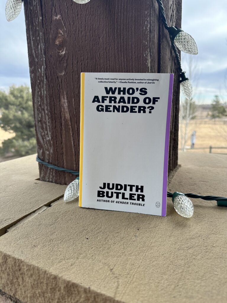 The cover of Who's Afraid of Gender? by Judith Butler shows the title and author on a blank white background rimmed in yellow and purple