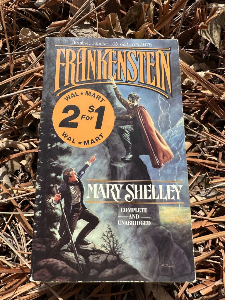 The cover of Frankenstein by Mary Shelley shows a monstrous figure on a cliff looming over a man who looks up, points, and screams