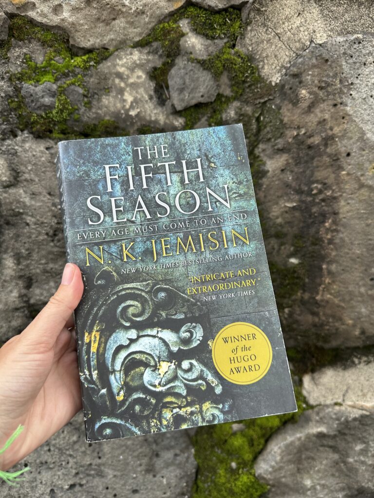 The cover of The Fifth Season shows  a stonework carving of leaves and spirals
