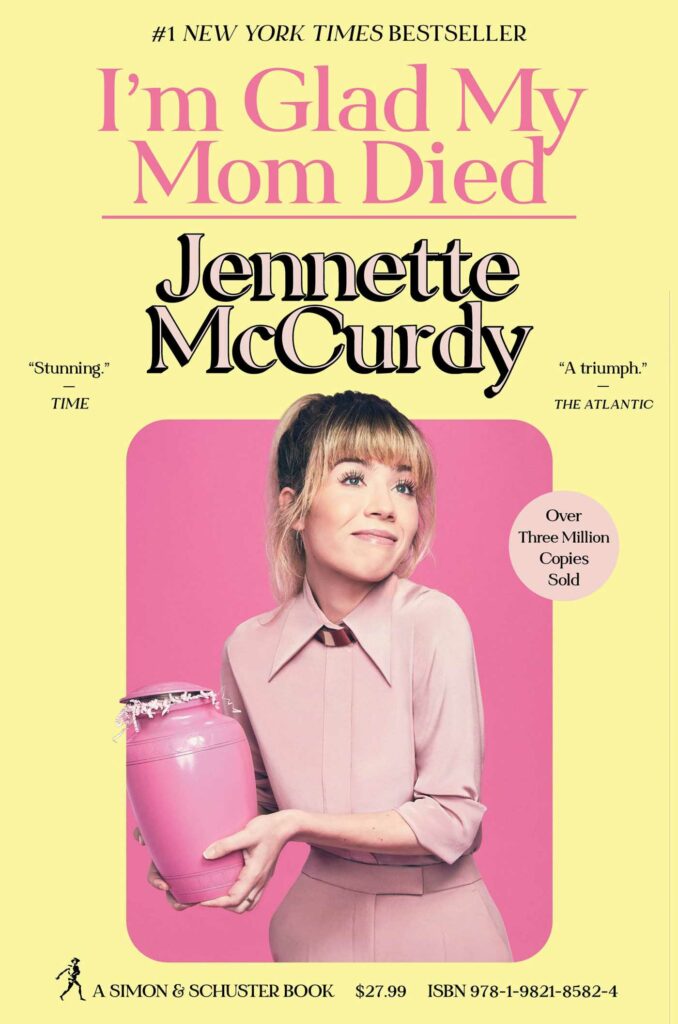 The cover of I’m Glad My Mom is Dead shows a young white woman (Jennette McCurdy) in a pink suit holding a pink urn. Her expression is like “sorry, not sorry"